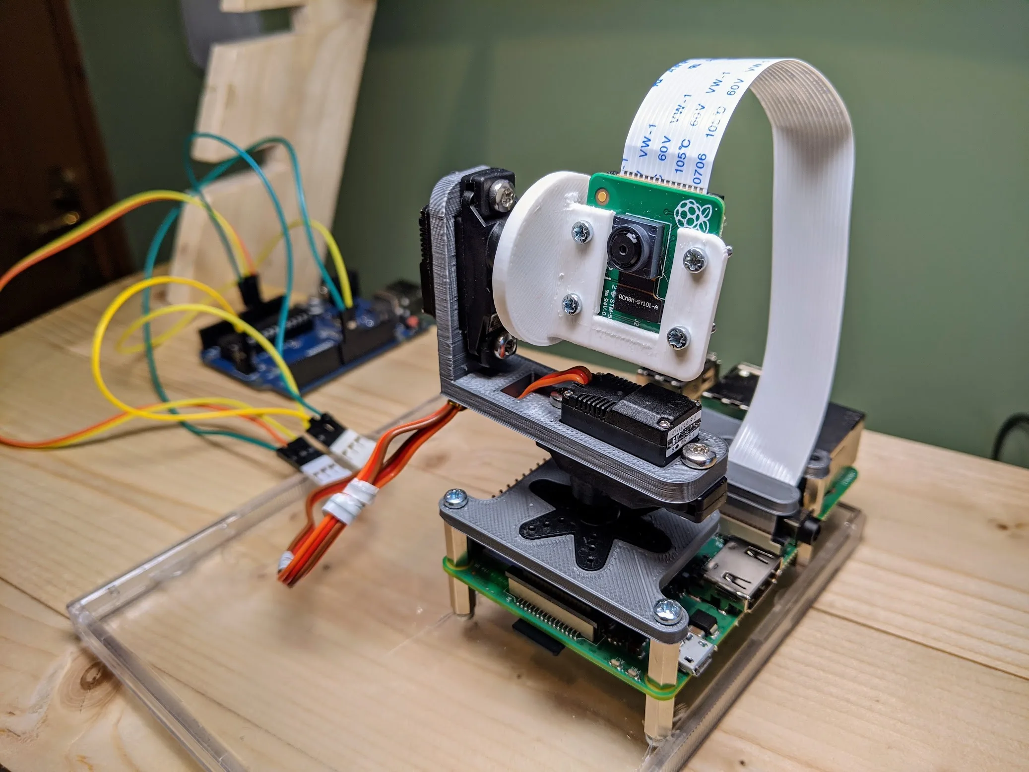 Camera and motorised mount attached to a Raspberry Pi on a workbench